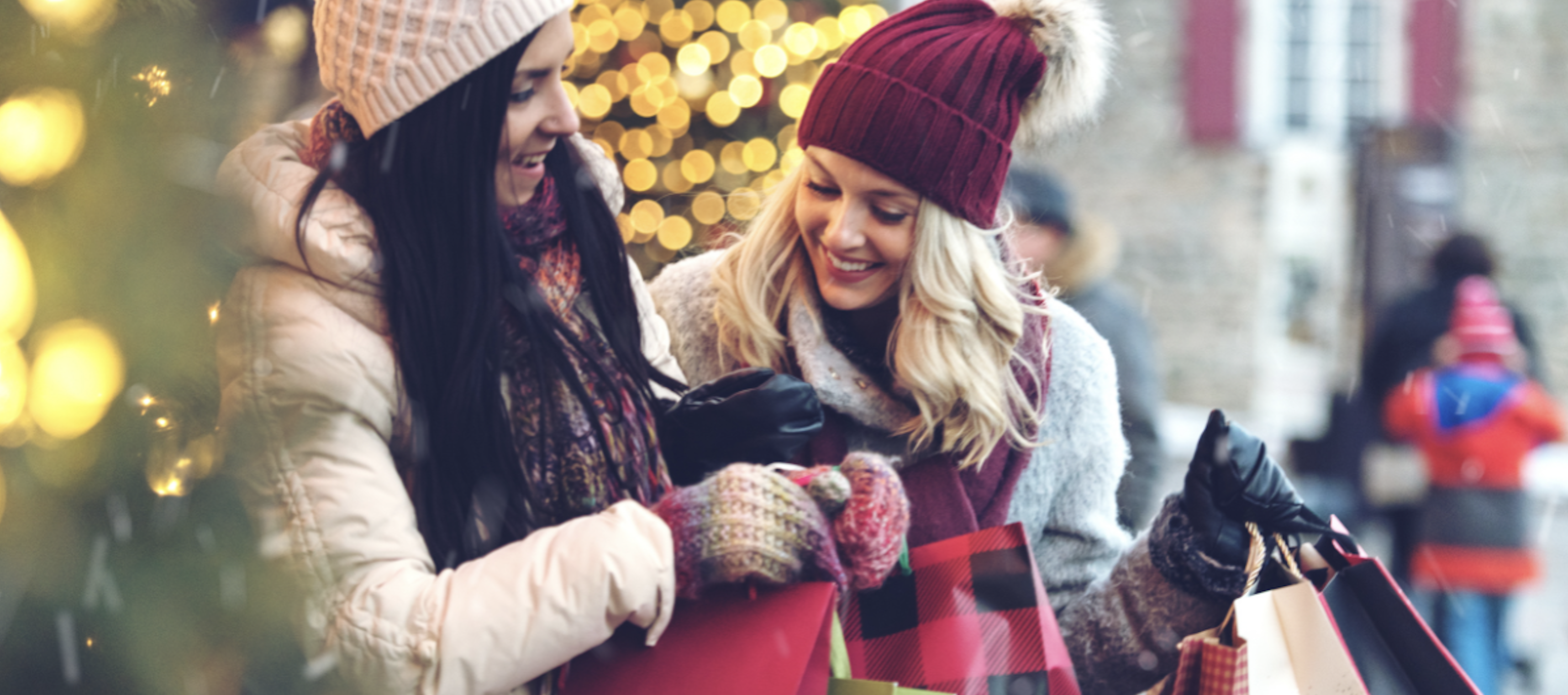 two woman shopping during the holidays